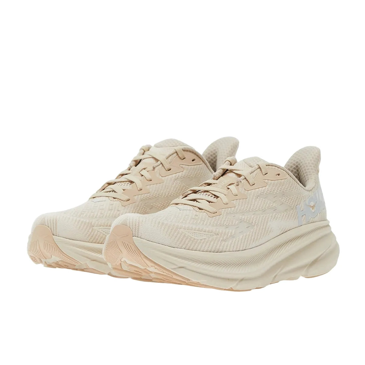 Hoka One One Clifton 9 sneakers for women, front view, model 1127896-SSEG, in shifting sand color with a comfortable fit.