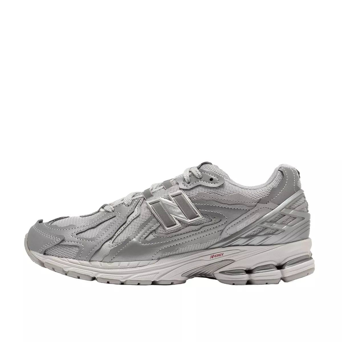 New Balance 1906D Protection Pack sneakers, side view, model M1906DH-1 in silver metallic with grey and white accents.