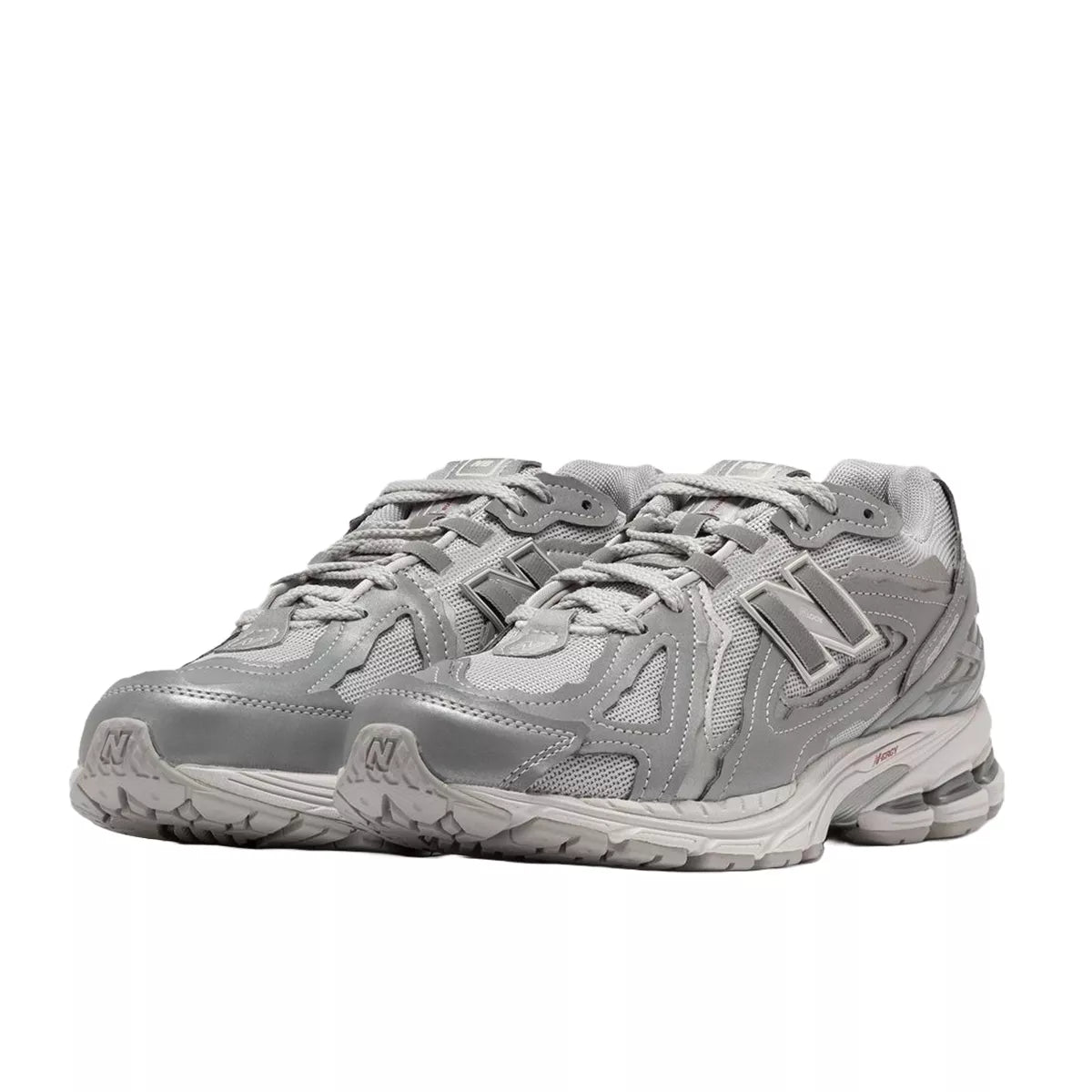 New Balance 1906D Protection Pack sneakers, front view, model M1906DH-1 in silver metallic with grey and white accents.