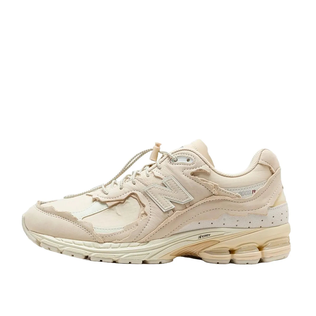 New Balance 2002R Protection Pack sneakers in Sandstone, side view, model M2002RDQ in beige.