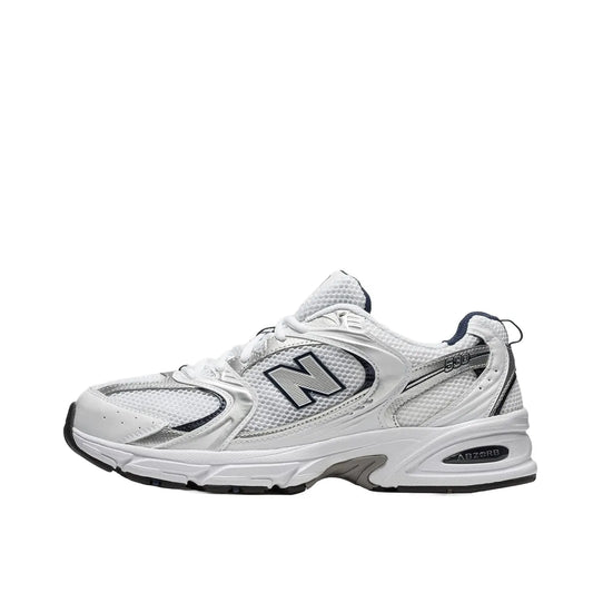 New Balance 530 sneakers, side view, model MR530SG, in white with silver and navy accents.