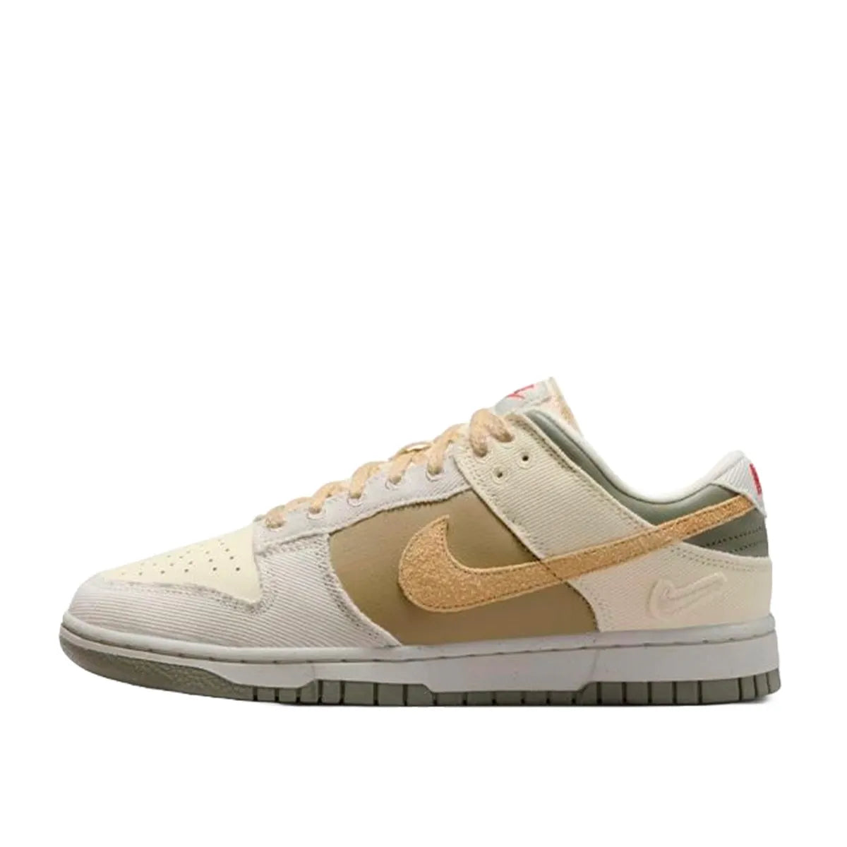 Nike Dunk Low Women's sneakers, side view, model FZ4341-100, in light bone with dark stucco and white accents.