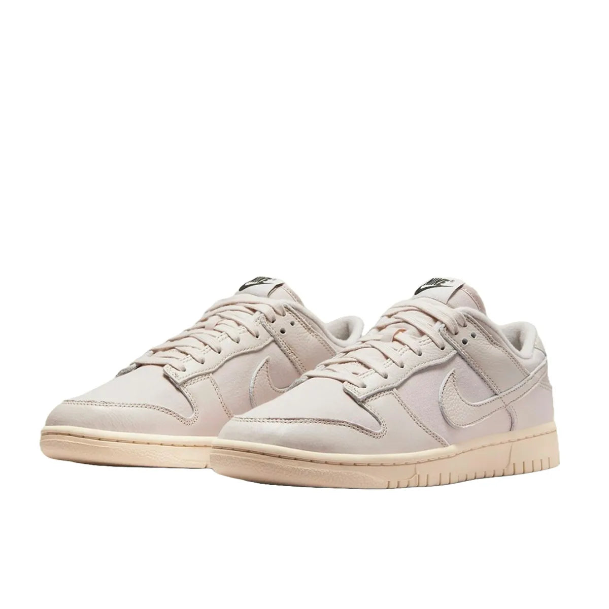 Nike Dunk Low Premium sneakers, front view, model DZ2538-100, in light orewood brown with white and beige accents.