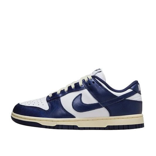 Nike Dunk Low PRM Women's sneakers, side view, model FN7197-100, in vintage navy with white accents.